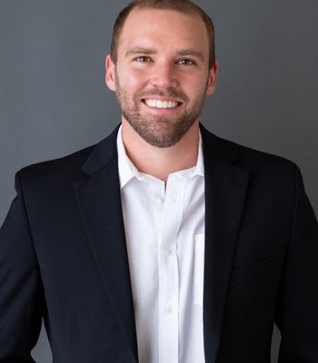 Portrait of Alex Hollman, REALTOR®.